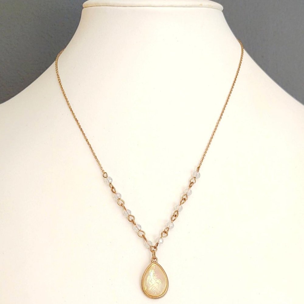 Iridescent yellow bead pendant w/clear bead accent